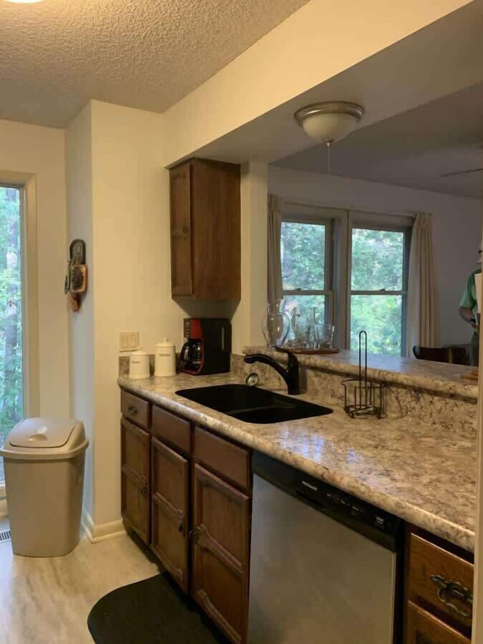 Bright kitchen with plenty of counter space — enjoy peaceful woodland views while you cook or sip your morning coffee.