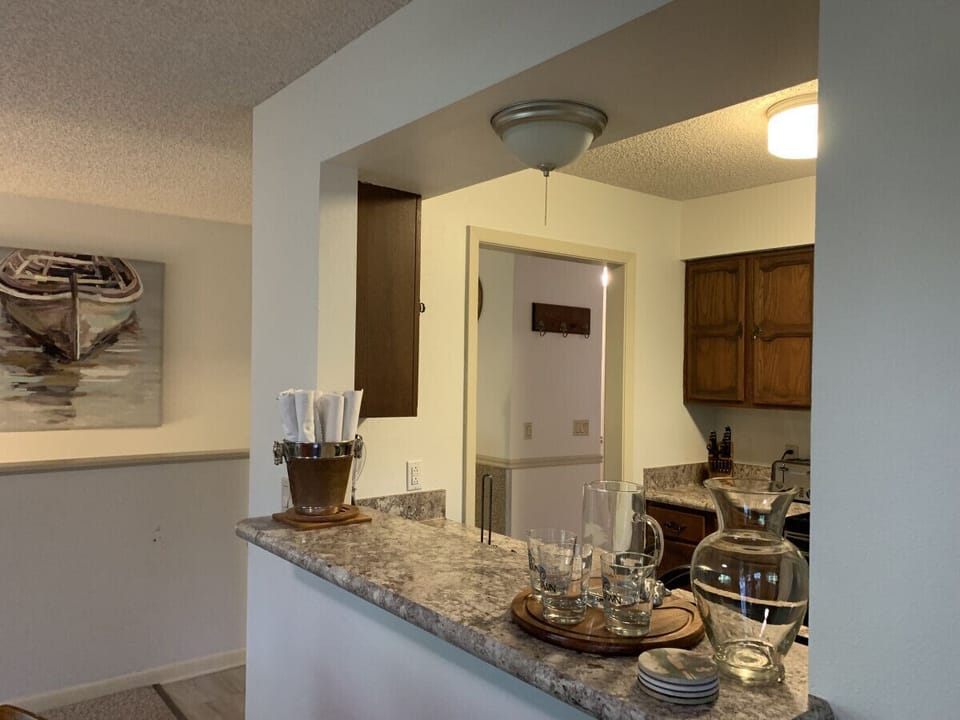 Open-concept kitchen and dining area designed for easy conversation — enjoy meals or morning coffee together.