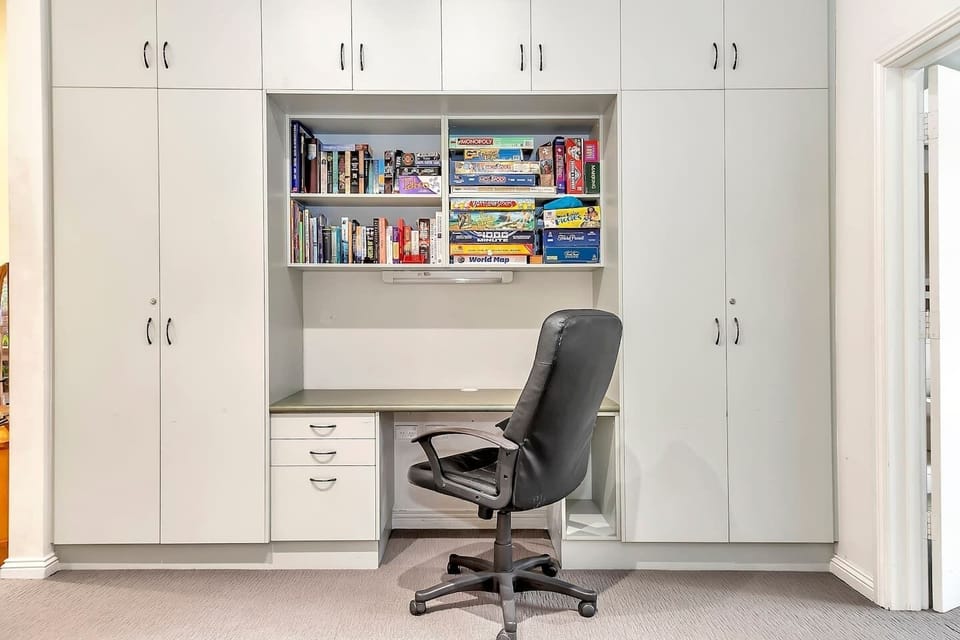 The study nook has a desk and ergonomic office chair and provides an ideal setup for remote workers. The shelves are stocked with a selection of books and board games for your entertainment. 

