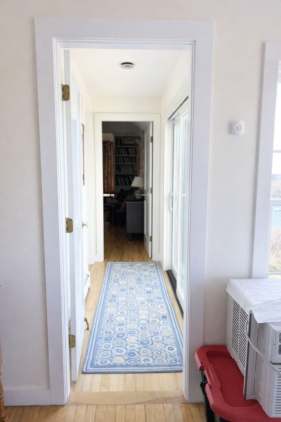 Off of the living area, down the hall, you will find the primary bedroom and attached bathroom.