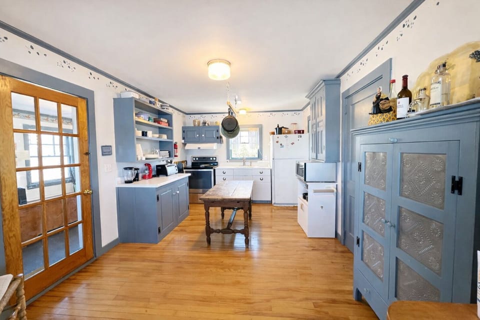 A view of the well equipped kitchen from the dining area.