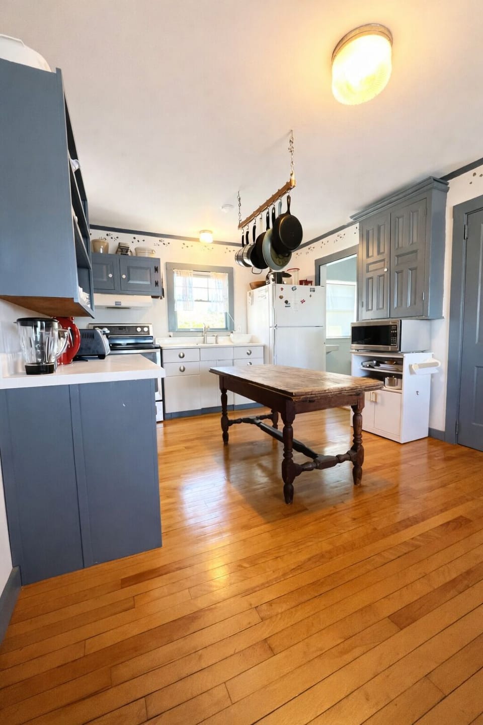 Upon entering the house you will walk down the hall into the kitchen.