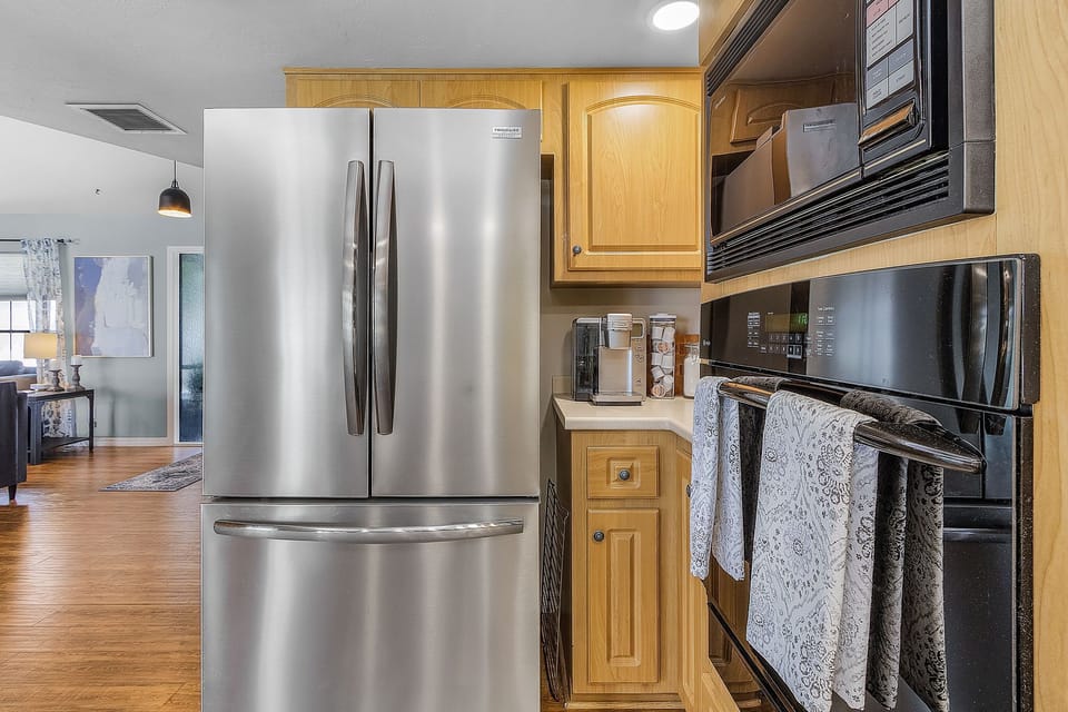 FILTERED WATER DISPENSER CONVENIENTLY INSIDE DOOR OF NEW REFRIGERATOR