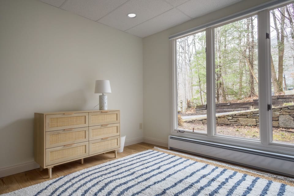 Lower-level bedroom with 2 sets of twin-size bunk beds & en suite bathroom.