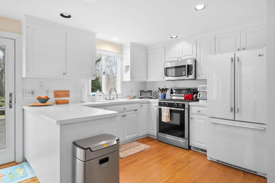 Set out a buffet meal for friends or family on the peninsula or overlook the serene yard space while at the sink - 853 Route 28 Harwich Port Cape Cod - Sandy Spot