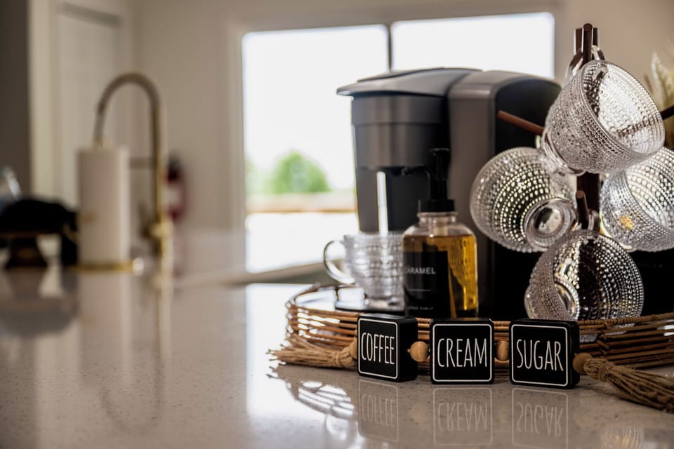 Fully stocked coffee/tea bar with kcups, sweetener, creamers & syrups.