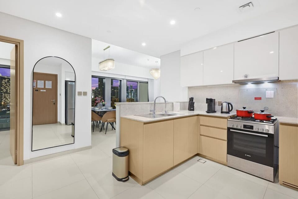 Modern Kitchen: Sleek design and city views ready for your culinary adventures!