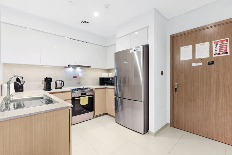 Kitchen: Modern amenities await your culinary adventures in this stylish, fully-equipped kitchen!