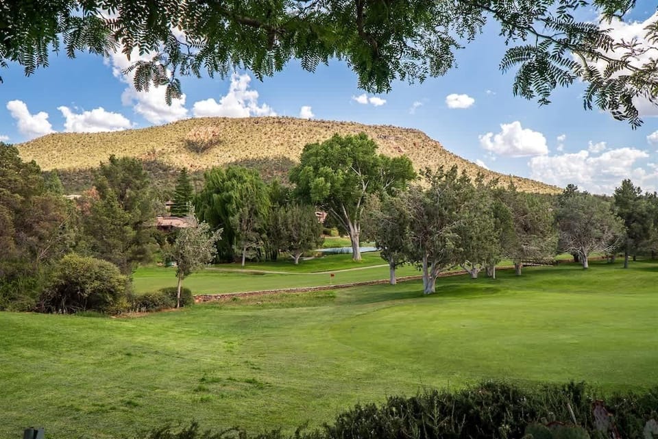 Bask in the View of the Golf Course and Greenery out the Dining Room Window