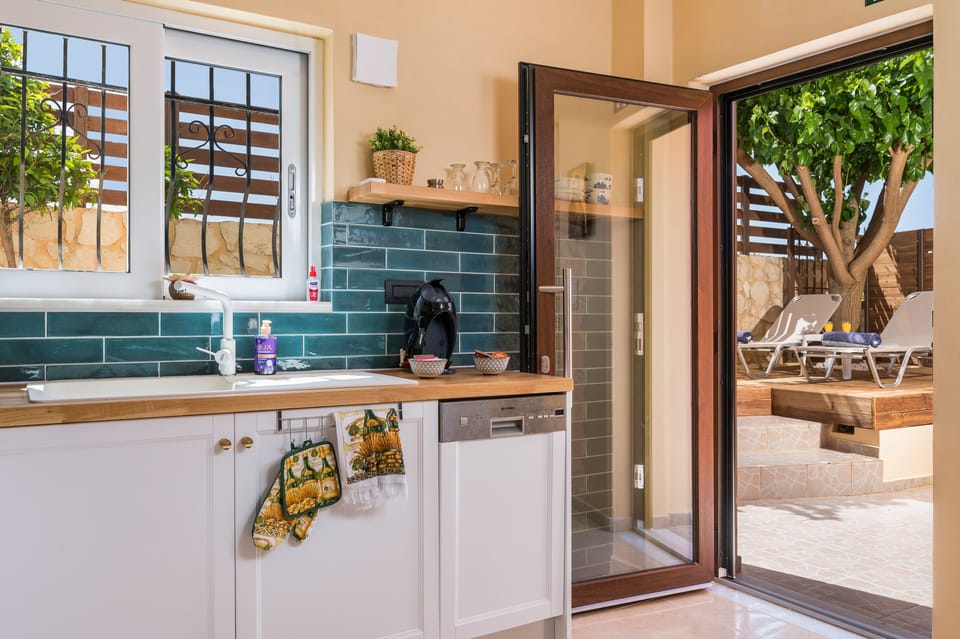 The kitchen offers all necessary pantry items and cooking equipment.