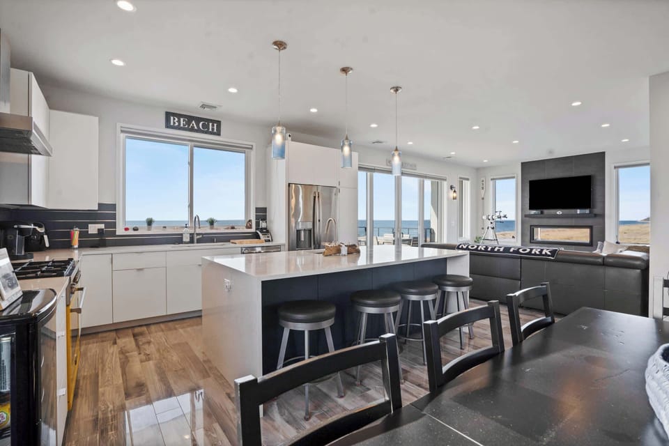 Open-concept space combining dining, living, and kitchen areas for modern living