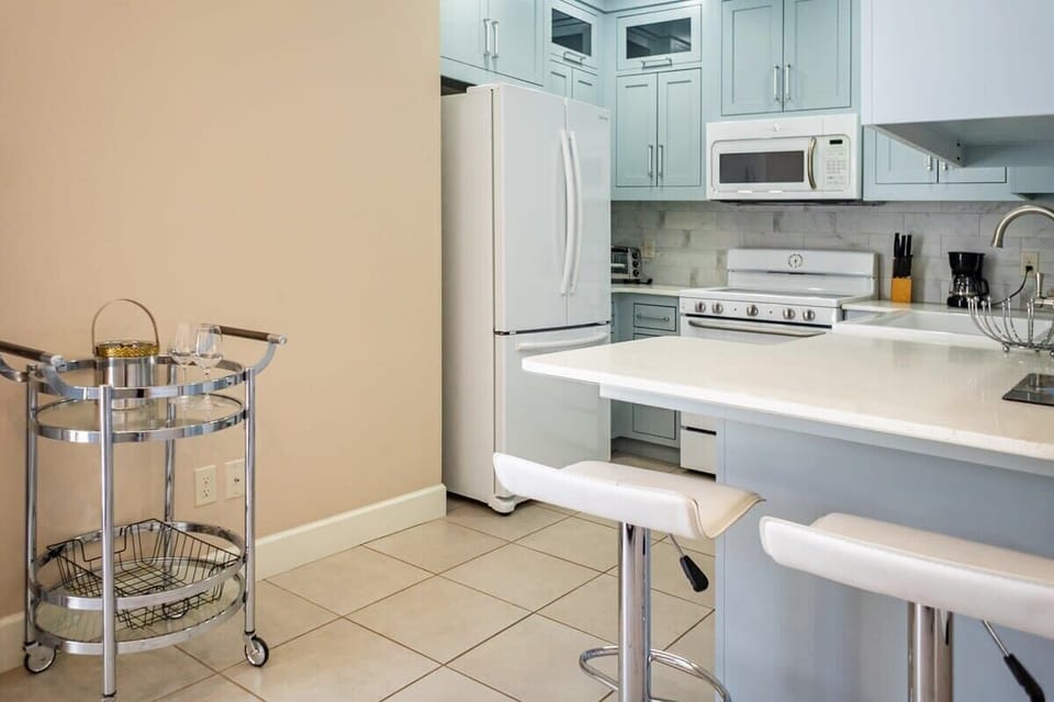 A bright kitchen featuring stunning white cabinets! 🏠✨ It's all about that fresh, clean look.