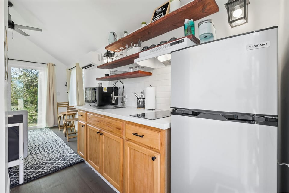 Kitchen with apartment sized fridge for your cooking needs