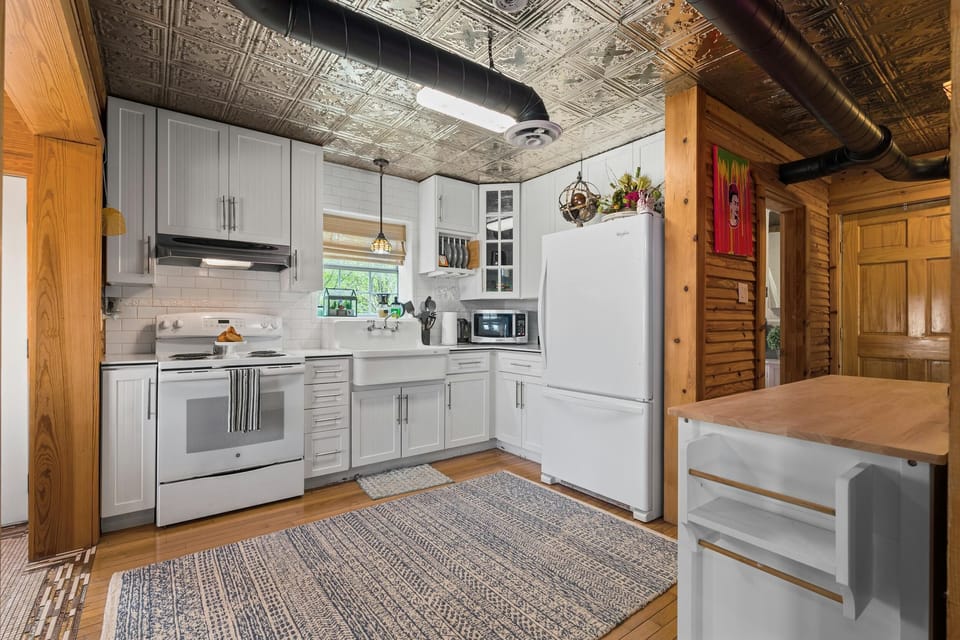 Twilight Ranch Kitchen leads to the second bath, staircase with loft room, and primary bedroom
