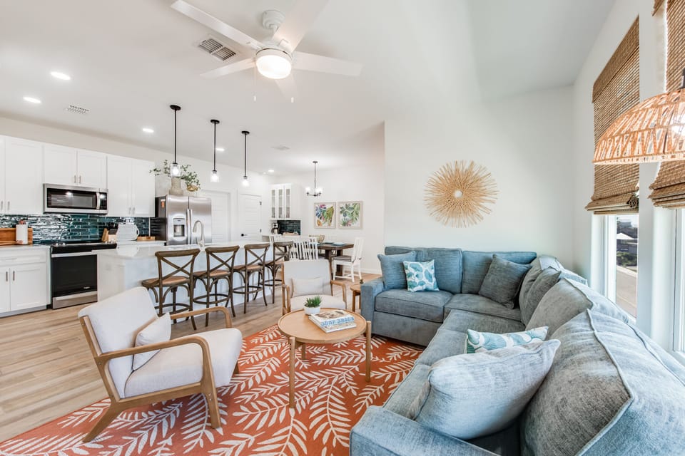Living Area - The kitchen, dining, and living areas blend seamlessly for a bright and airy feel