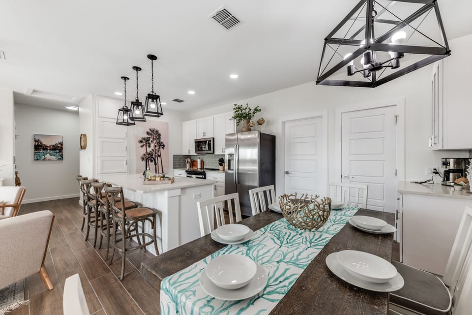 Kitchen - The kitchen, dining, and living areas blend seamlessly for a bright and airy feel