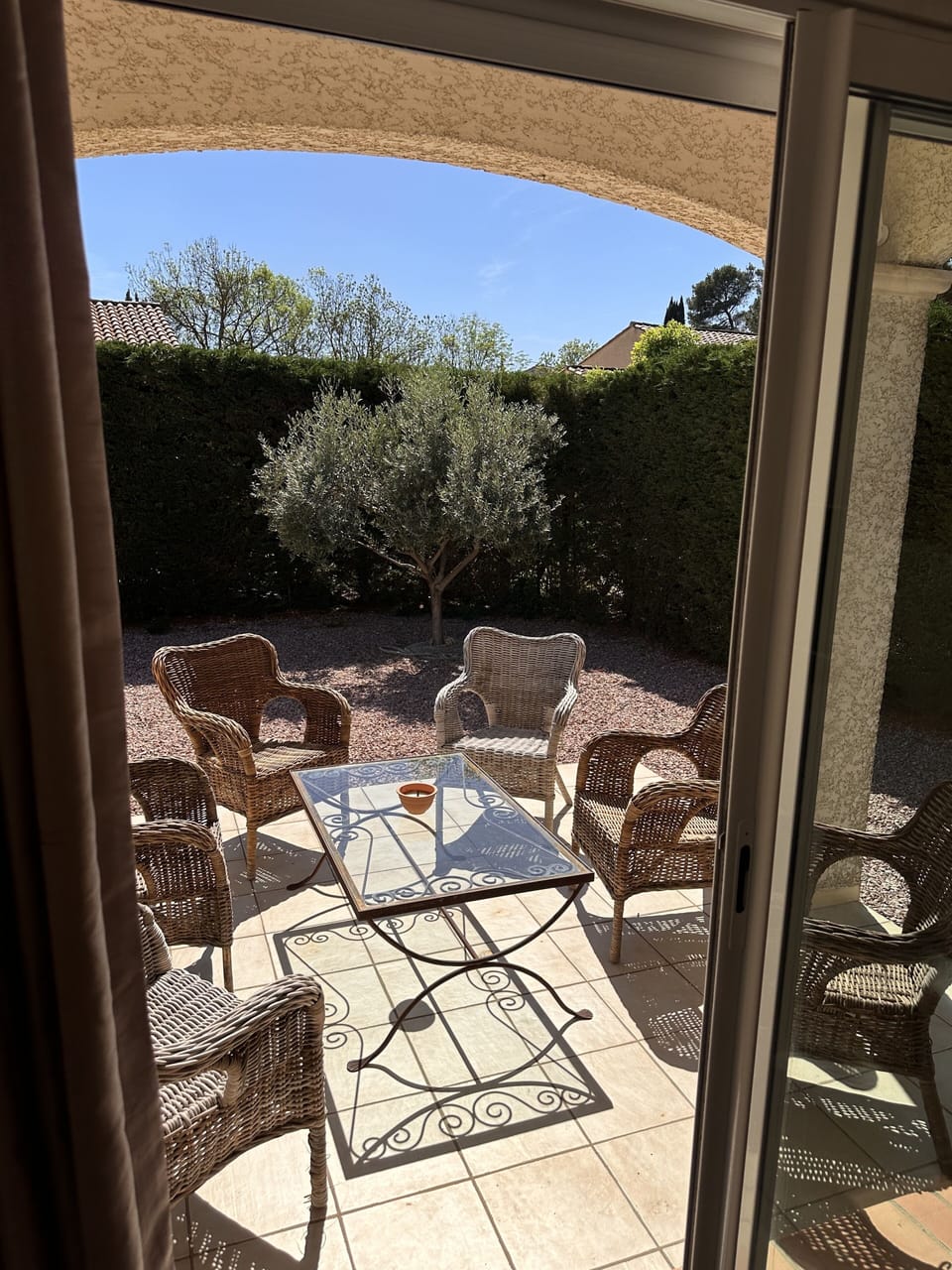 Covered terrace; 6 chairs and a coffee table.  Accessed via lounge area.