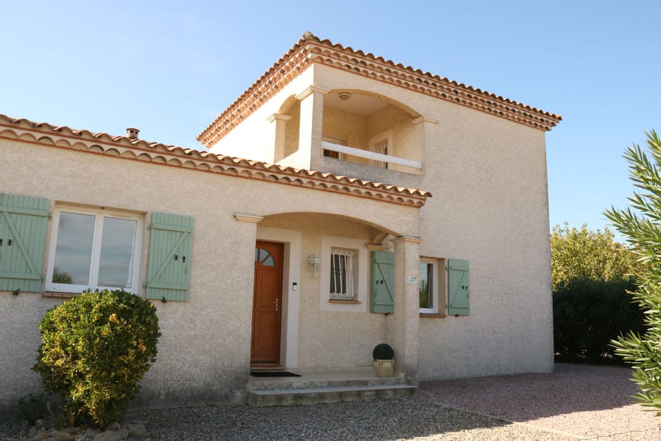 Front view of the villa.  Driveway parking.  The villa garden is fully enclosed.