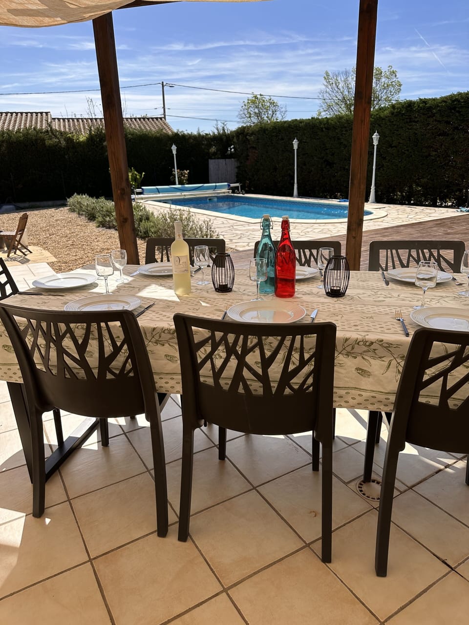 Shaded terrace area for alfresco dining. 8 chairs and a table.  Overlooks pool.