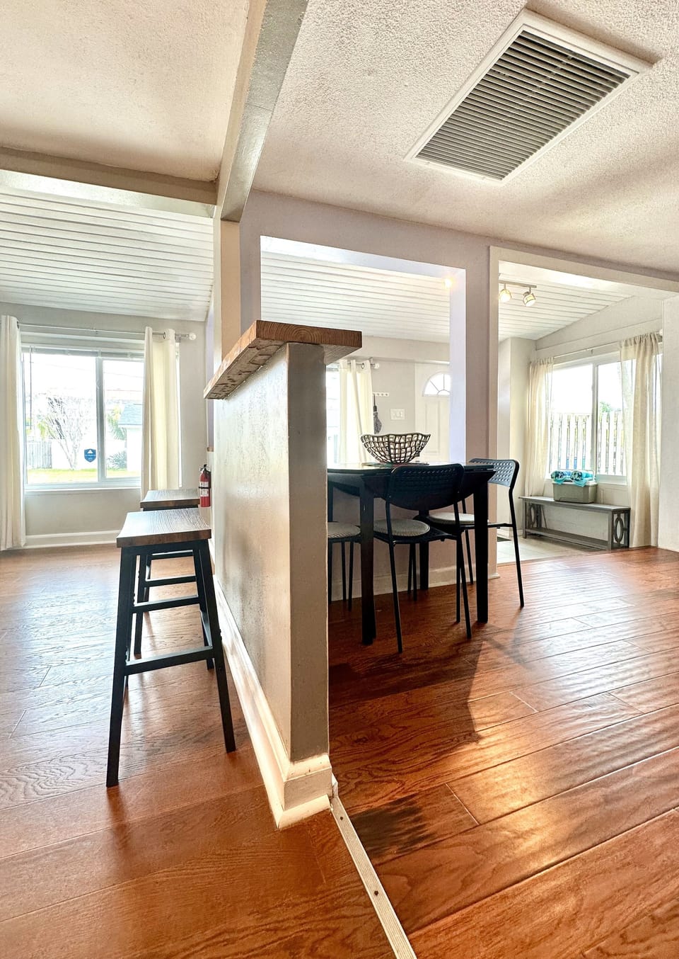 Dining table with 3 seating and 2 bar stools.