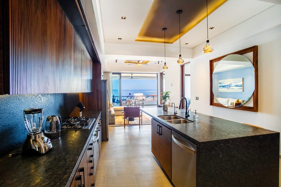 The kitchen amenities include a full-size fridge, stove, oven and dishwasher