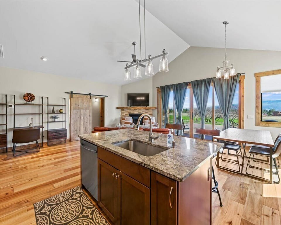 Open-concept living room with cozy seating and panoramic views.