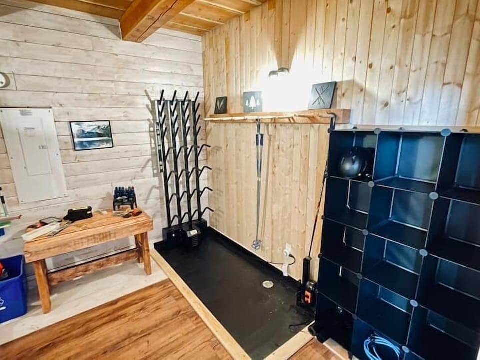 Gear room with boot driver, ski rack, extra fridge, simple tools, and washer/dryer 