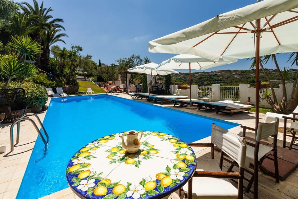 Property, Plant, Sky, Furniture, Water, Umbrella, Azure, Swimming Pool, Building, Chair