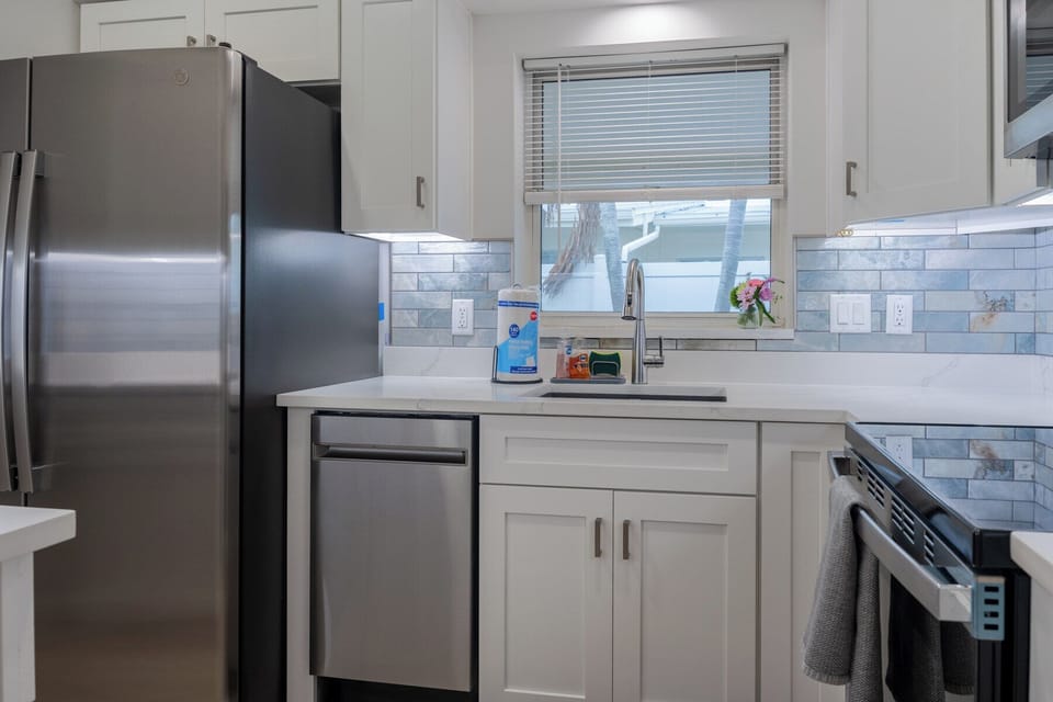 Chef's kitchen with new stainless steel appliances.