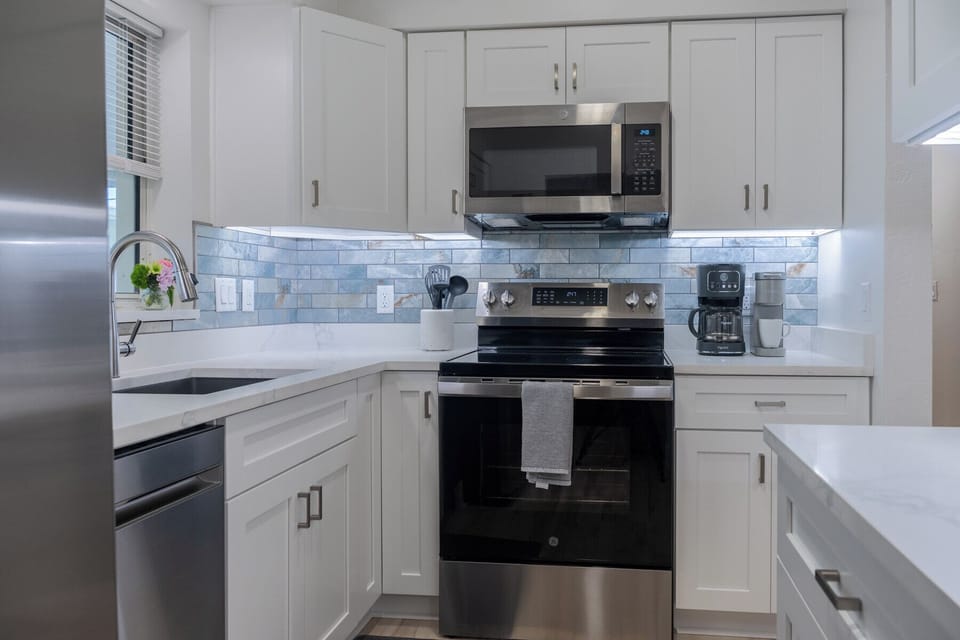Chef's kitchen with new stainless steel appliances.