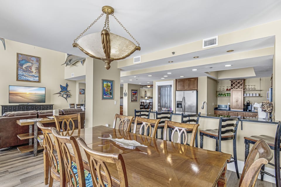 This Penthouse condo has a large, open living space - all with incredible views and fun, coastal decor!