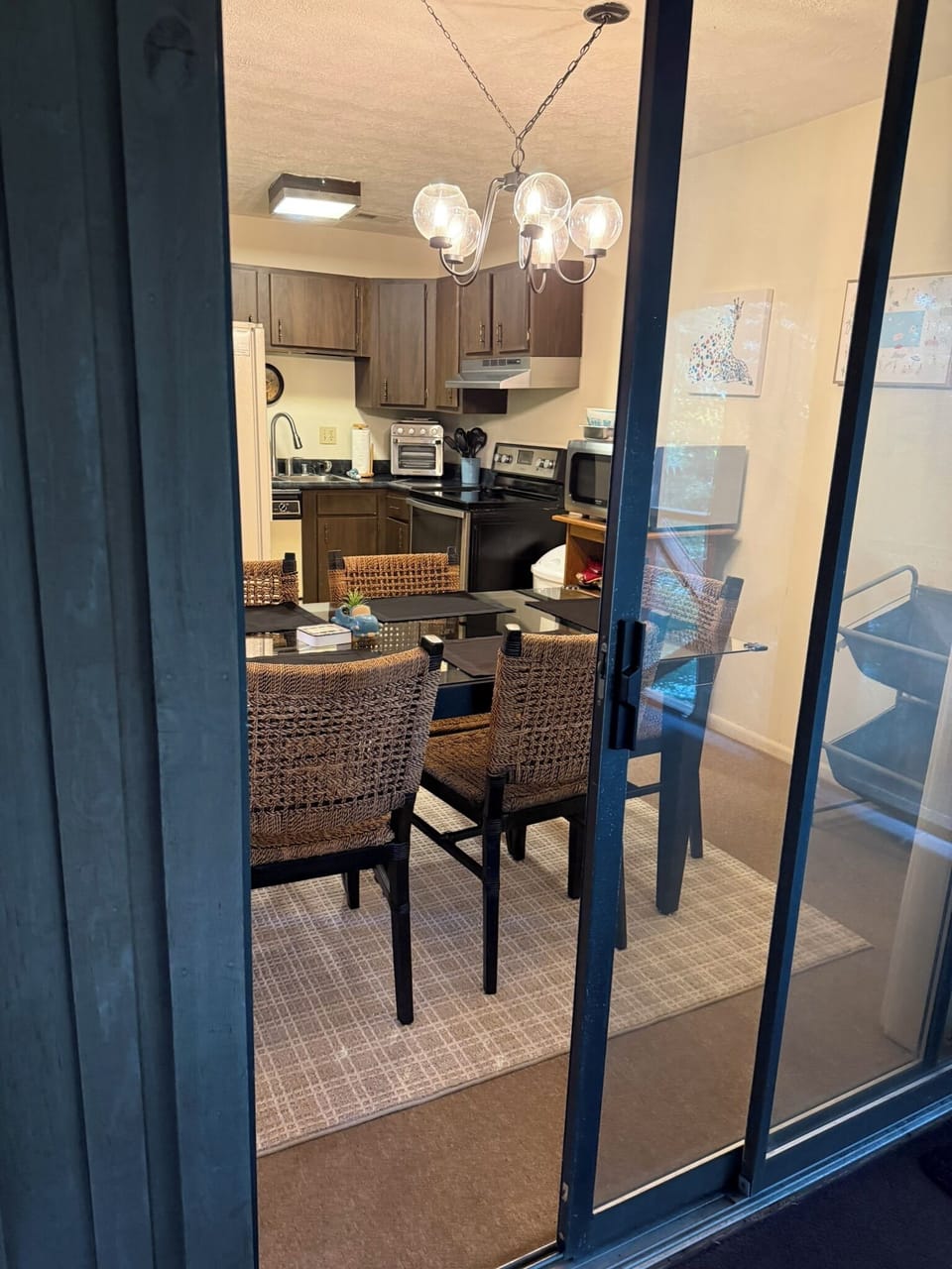 View of kitchen and dining area from deck