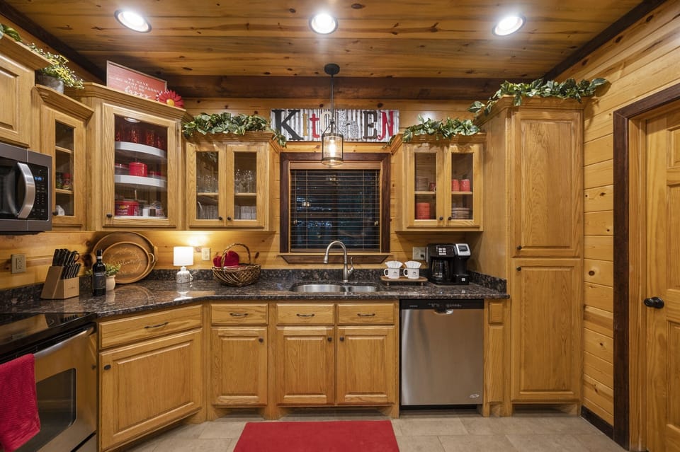 Cook up a family feast or a meal for two in the fully-stocked kitchen, featuring modern appliances, granite countertops and timber-rich touches.