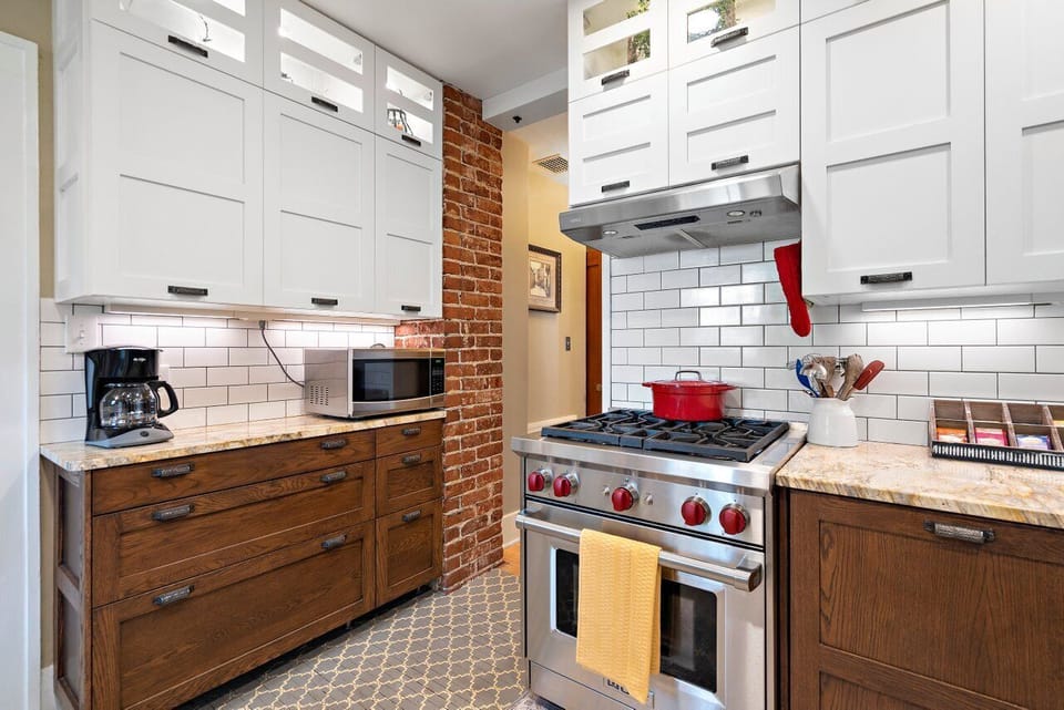 Updated kitchen with Wolf gas range and hidden panel front dishwasher