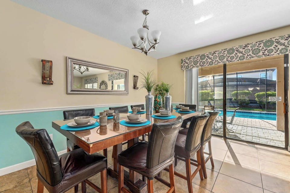 Dining area set by sliding doors, great for shared meals w/ easy indoor-outdoor flow.