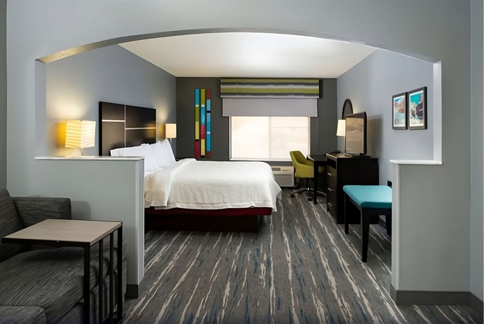 Step into your spacious suite with dedicated work desk.