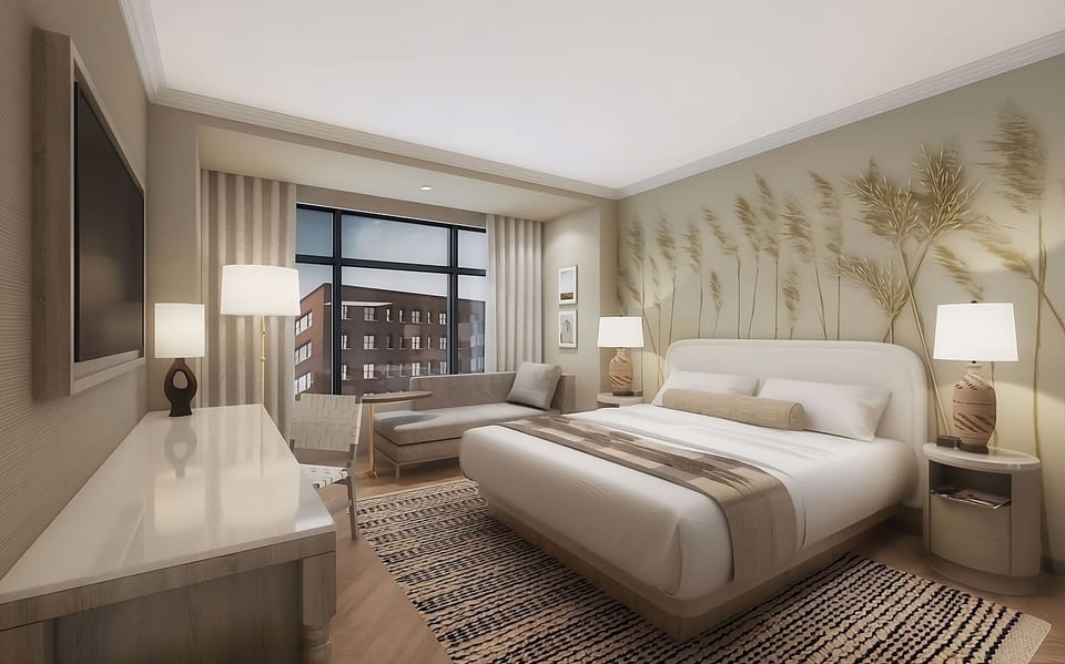 Relax into a cloud-soft king bed under warm ambient light.