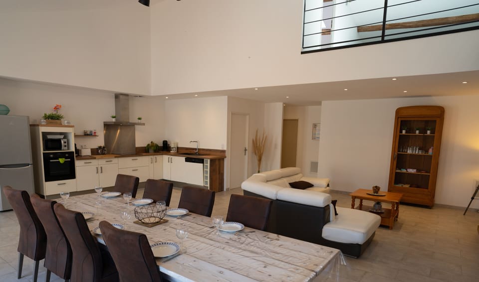 Large air-conditioned lounge opening onto the kitchen and terrace