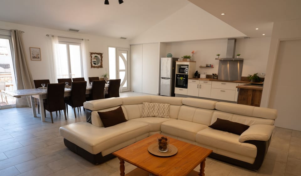 Large air-conditioned lounge opening onto the kitchen and terrace