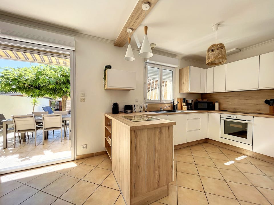 New, fully-equipped kitchen opening onto the living room and garden