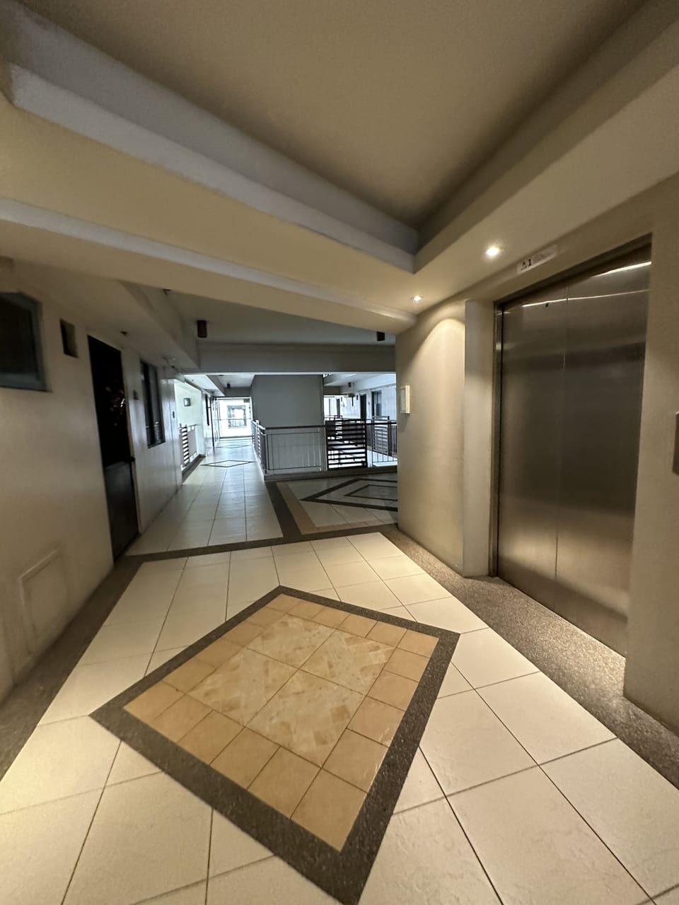 Main elevator takes you to the corner unit next to emergency exit stairs.