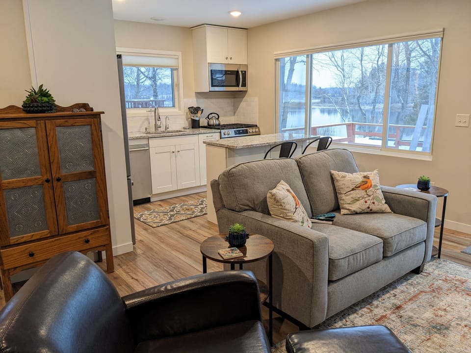 Living area with window overlooking waterfront