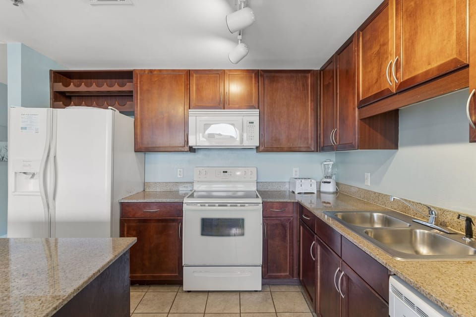 kitchen with wooden cabinets and modern appliances for convenient cooking