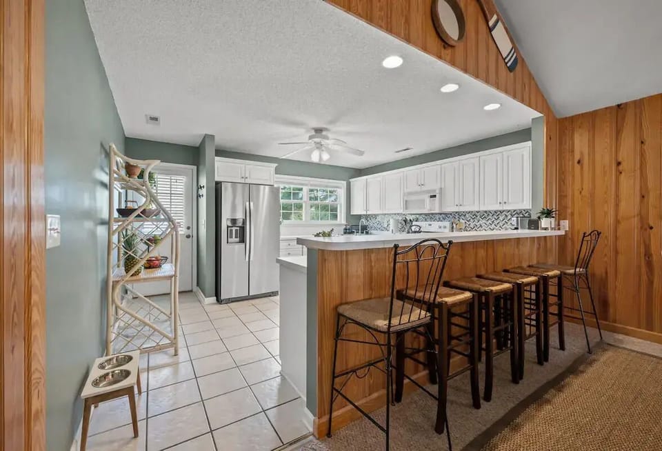 Kitchen with bar that seats 6
