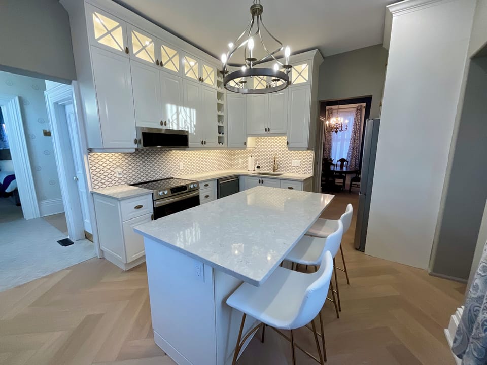 Open & inviting well equipped kitchen perfect for preparing meals & entertaining