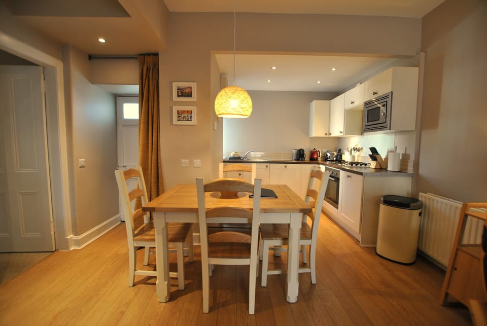 The dining area has plenty space for four guests to dine together