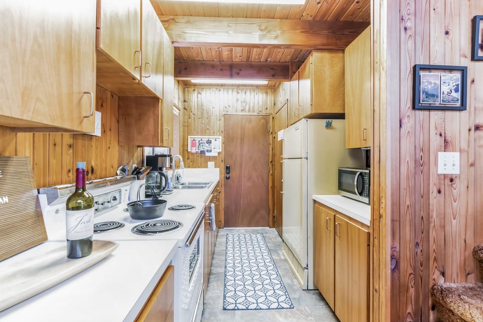 Retro cabin kitchen with vintage stove.