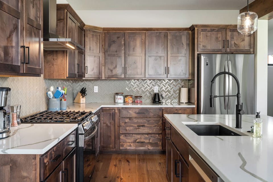 Fully-stocked kitchen with dishwasher, microwave, coffee maker, blender, etc.