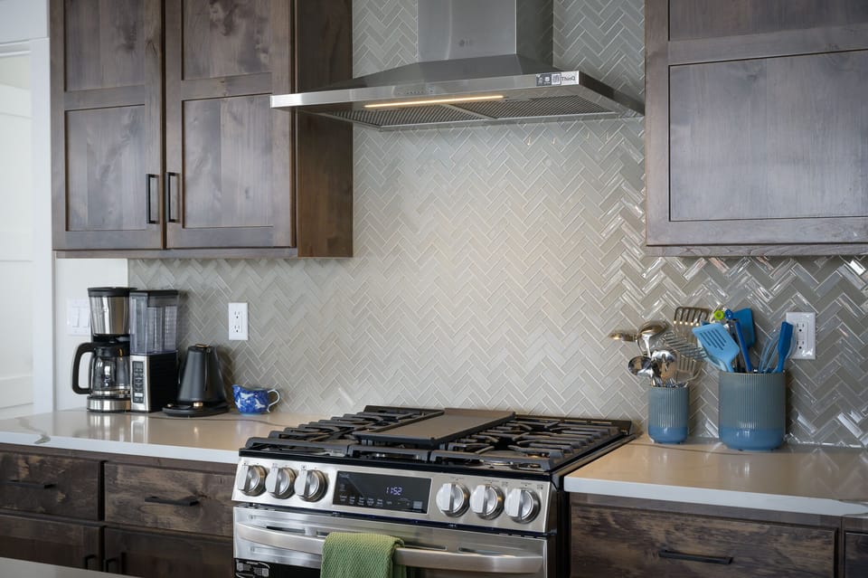 Gas range with griddle and true ventilation to the outside.