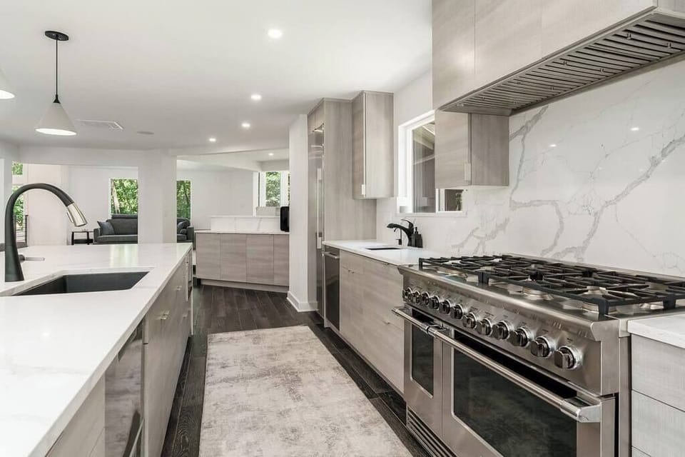 Precision meets style in this chef's paradise, equipped with top-tier appliances and designed for the art of cuisine.